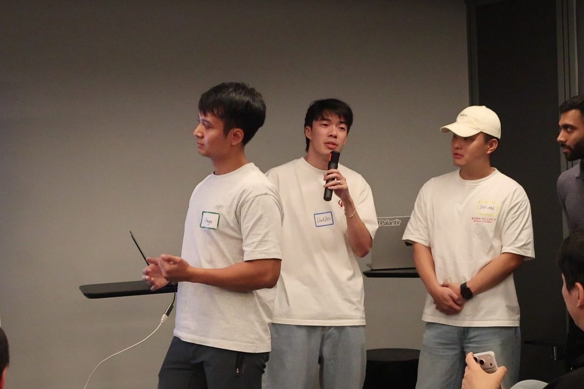 Learners with a microphone presenting their work to the class